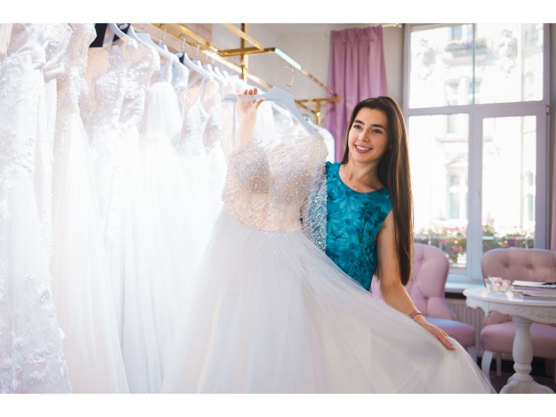 a girl choosing wedding dress